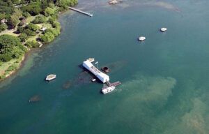 An aerial view of a large body of water with boats in it.