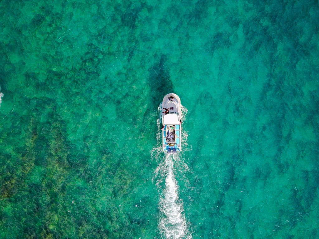 An aerial view of a boat in the ocean.