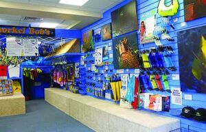 A store with a sign that says ' scuba bob 's ' on it