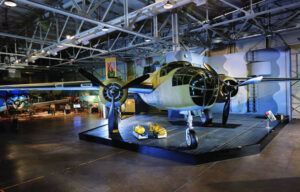 An old airplane is on display in a museum.