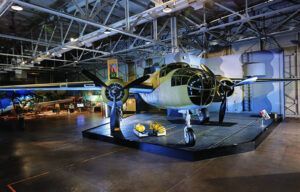 An old airplane is on display in a museum.