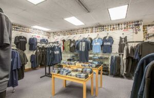 A store filled with lots of t-shirts and jackets.