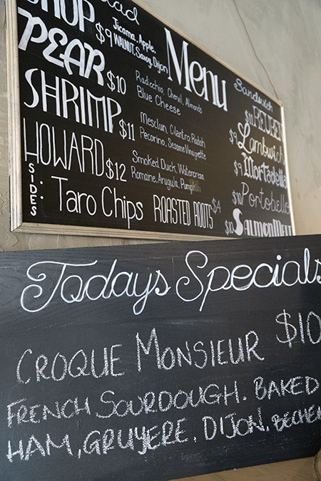 A chalkboard with a menu and today 's specials written on it