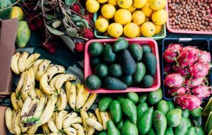 There are many different types of fruits and vegetables on the table.