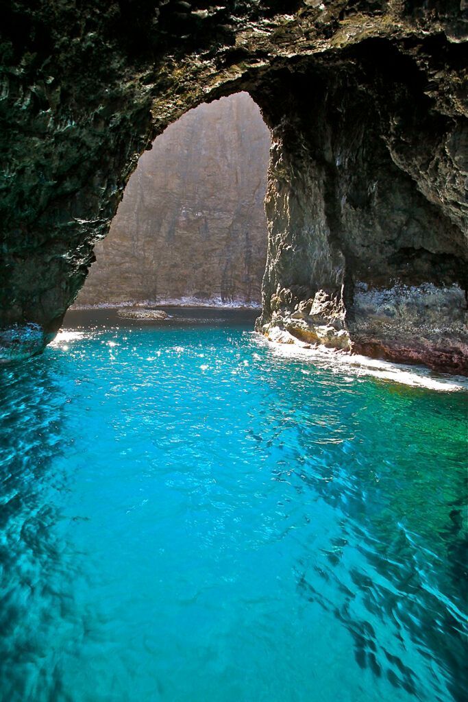 A cave in the middle of a body of water