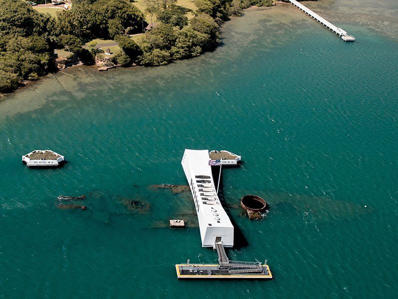 An aerial view of a dock in the middle of a body of water.
