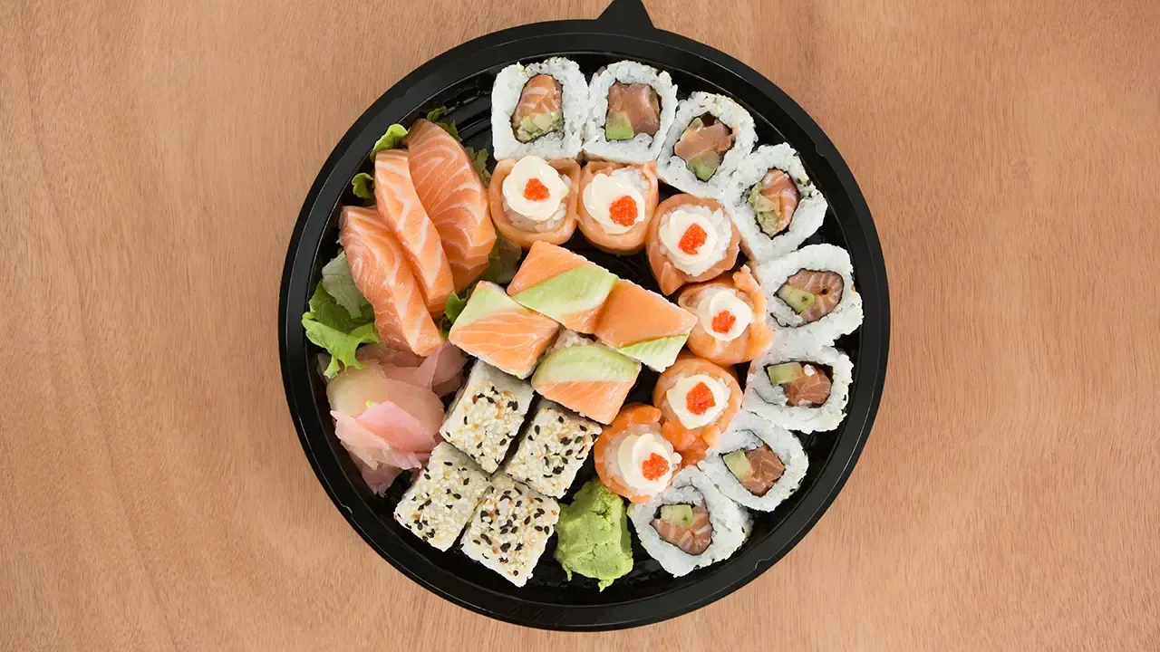 Sushi platters can be found alongside traditional thanksgiving favorites.