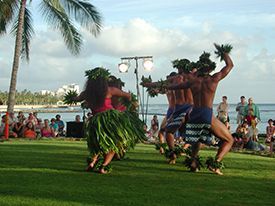 A group of people are dancing in front of a crowd.