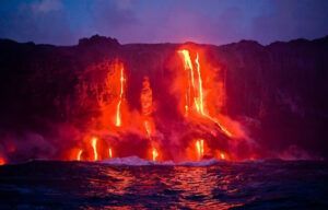 Lava is coming out of a volcano into the ocean.