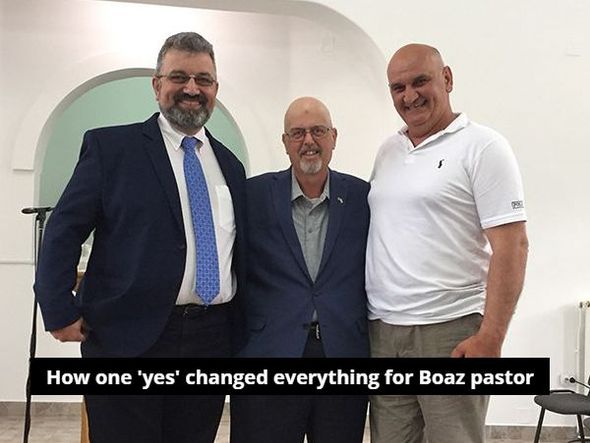 Three men posing for a picture with the caption how one yes changed everything for boaz pastor