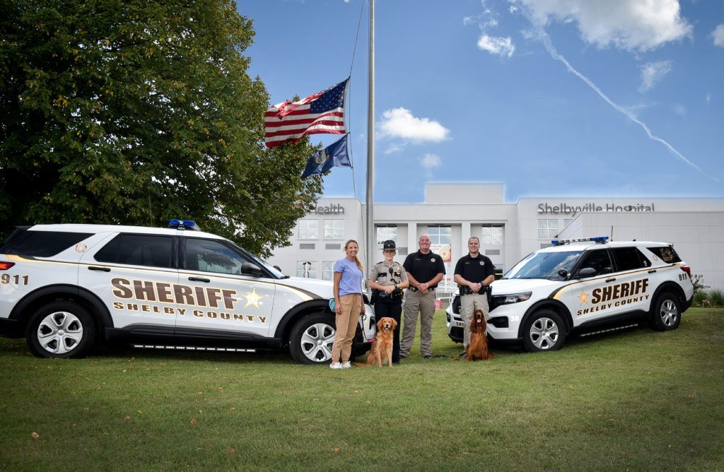 Police heroes with a therapy pet