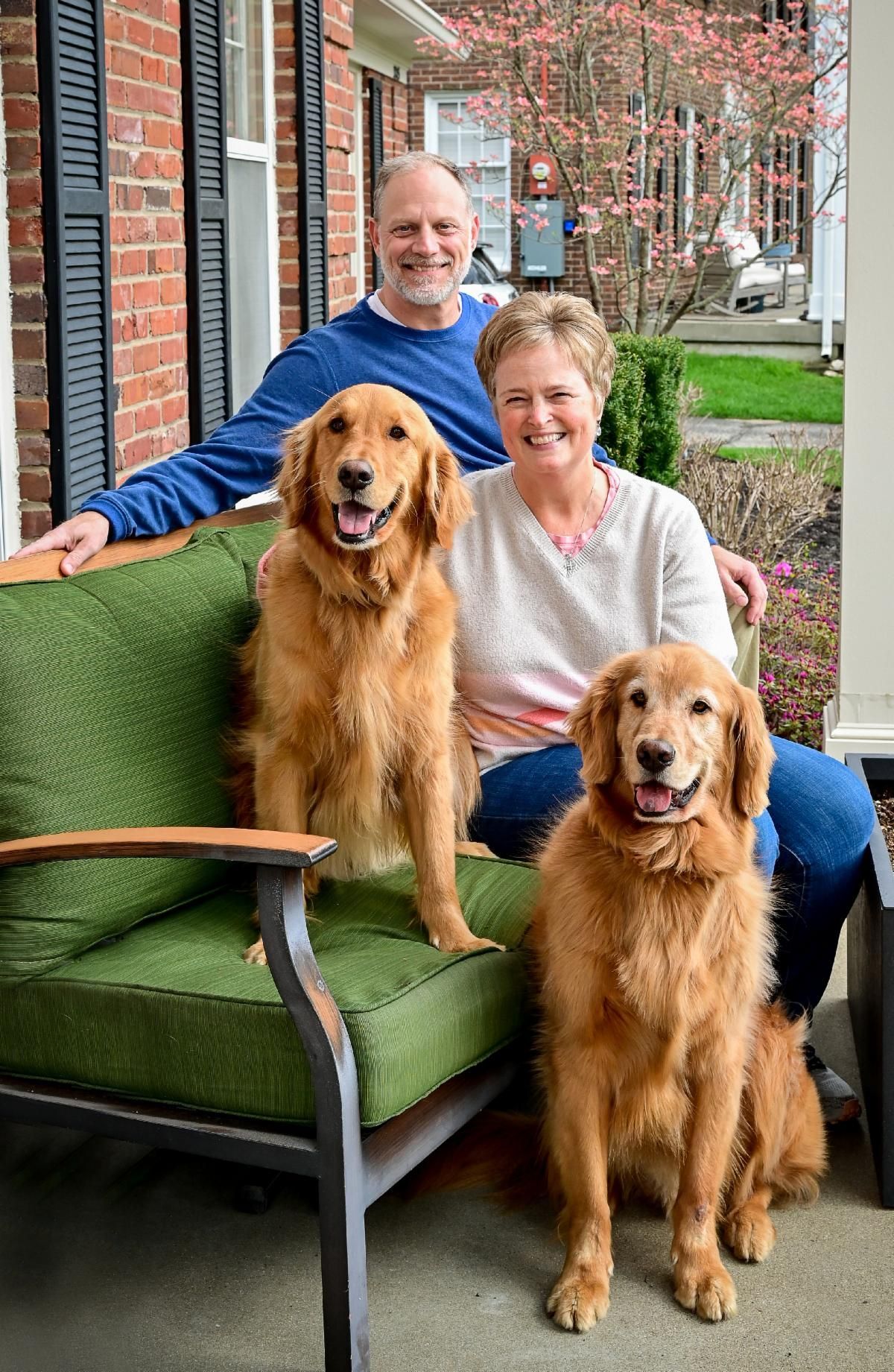 Family Photo with Two Golden Retrievers