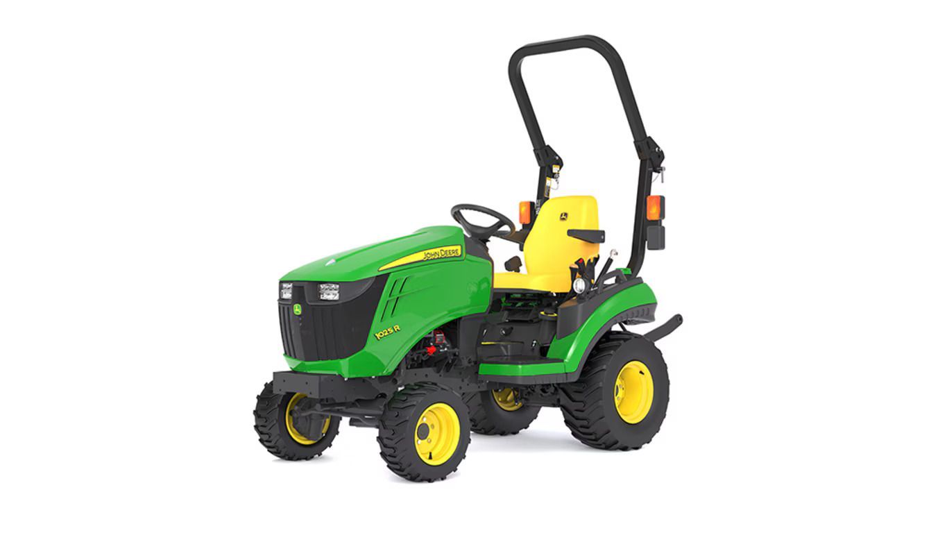 A green and yellow John Deere 1025R compact utility tractor on a white background.