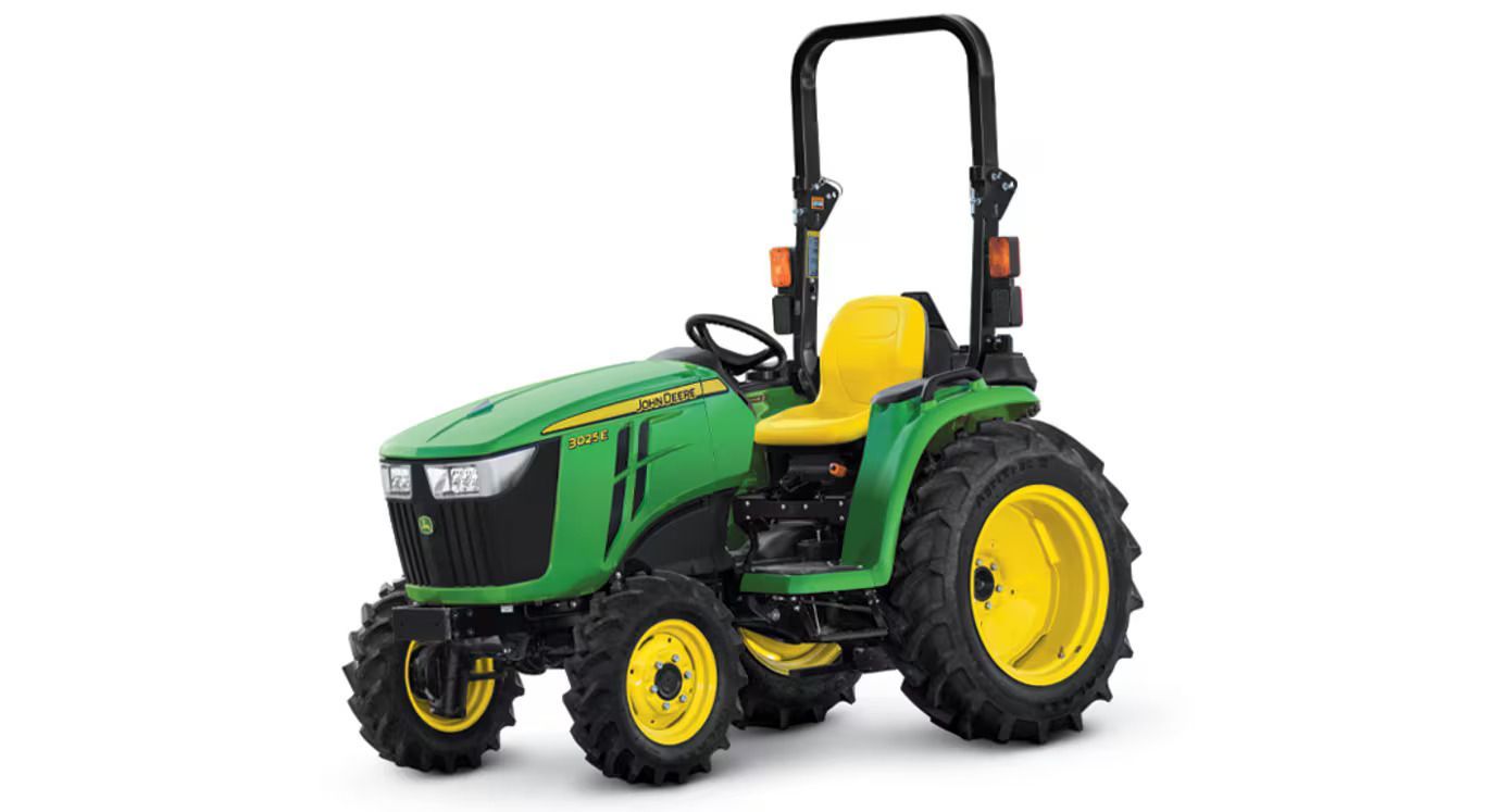 A John Deere 3025E compact tractor with green bodywork and yellow wheels.