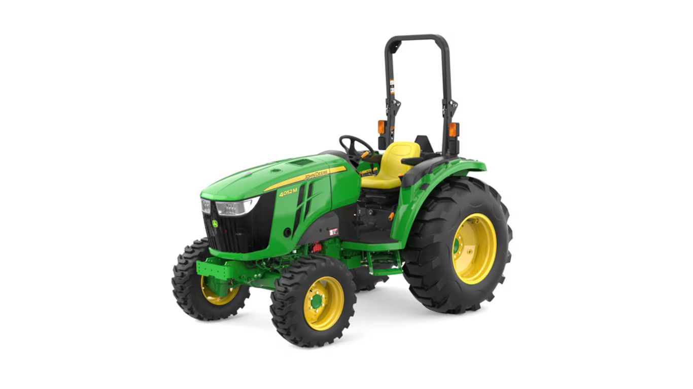 A green and yellow John Deere 4052M compact utility tractor on a white background.