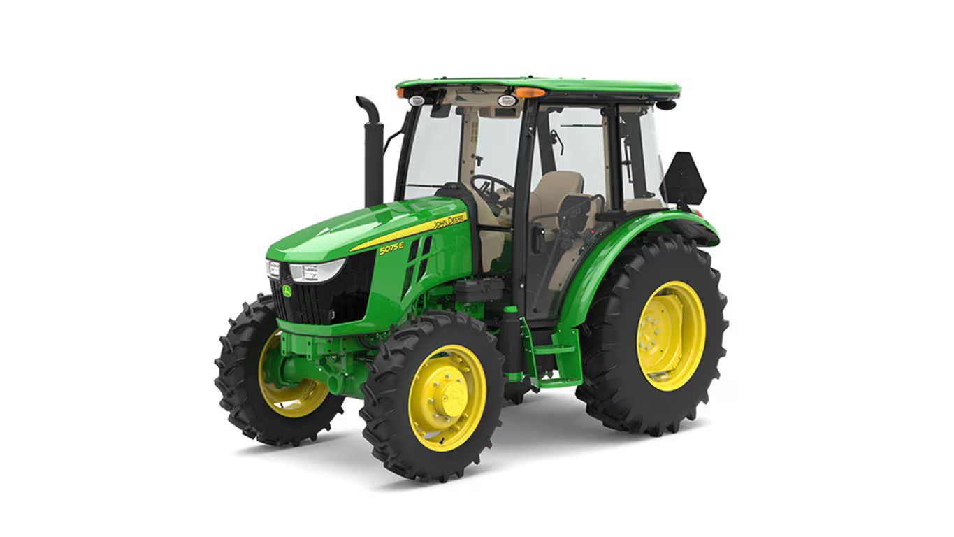 A John Deere 5075E tractor, green with yellow wheels, set against a plain white background.