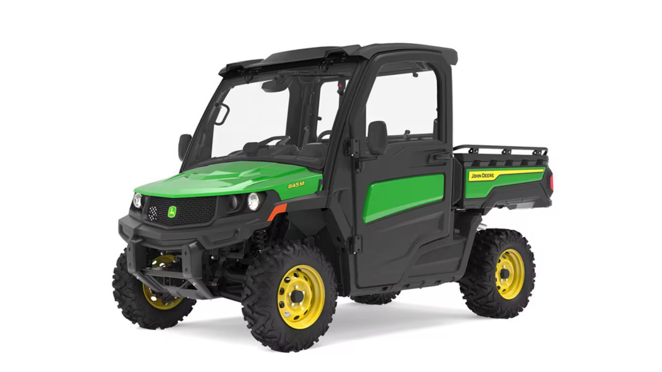 A green and black John Deere Gator utility vehicle shown from a front three-quarter angle on a white background.