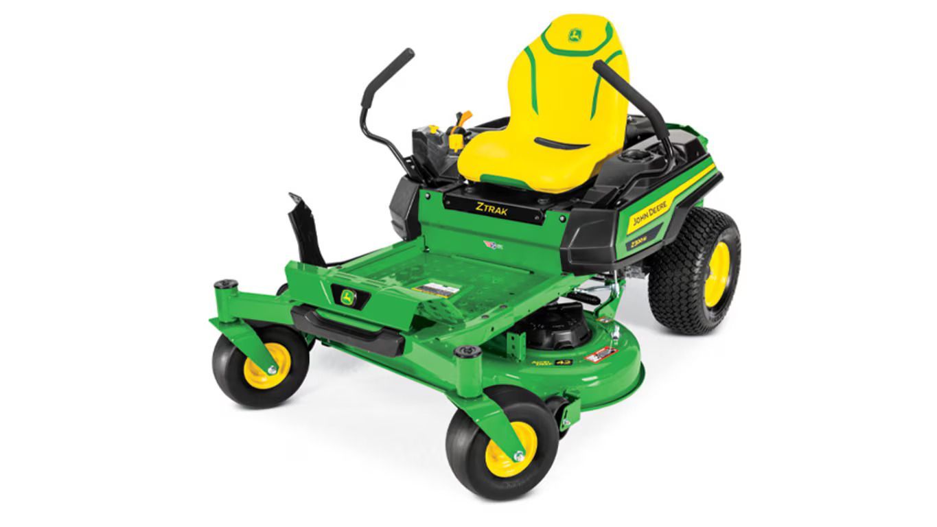 A green and yellow John Deere Z320M zero-turn riding lawn mower on a white background.