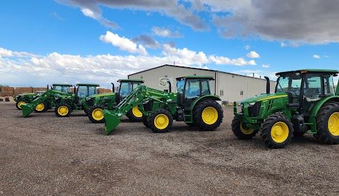 Deere tractors on a lawn