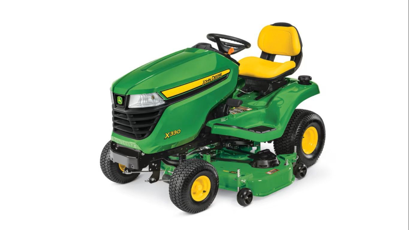A green and yellow John Deere Z320M zero-turn riding lawn mower on a white background.