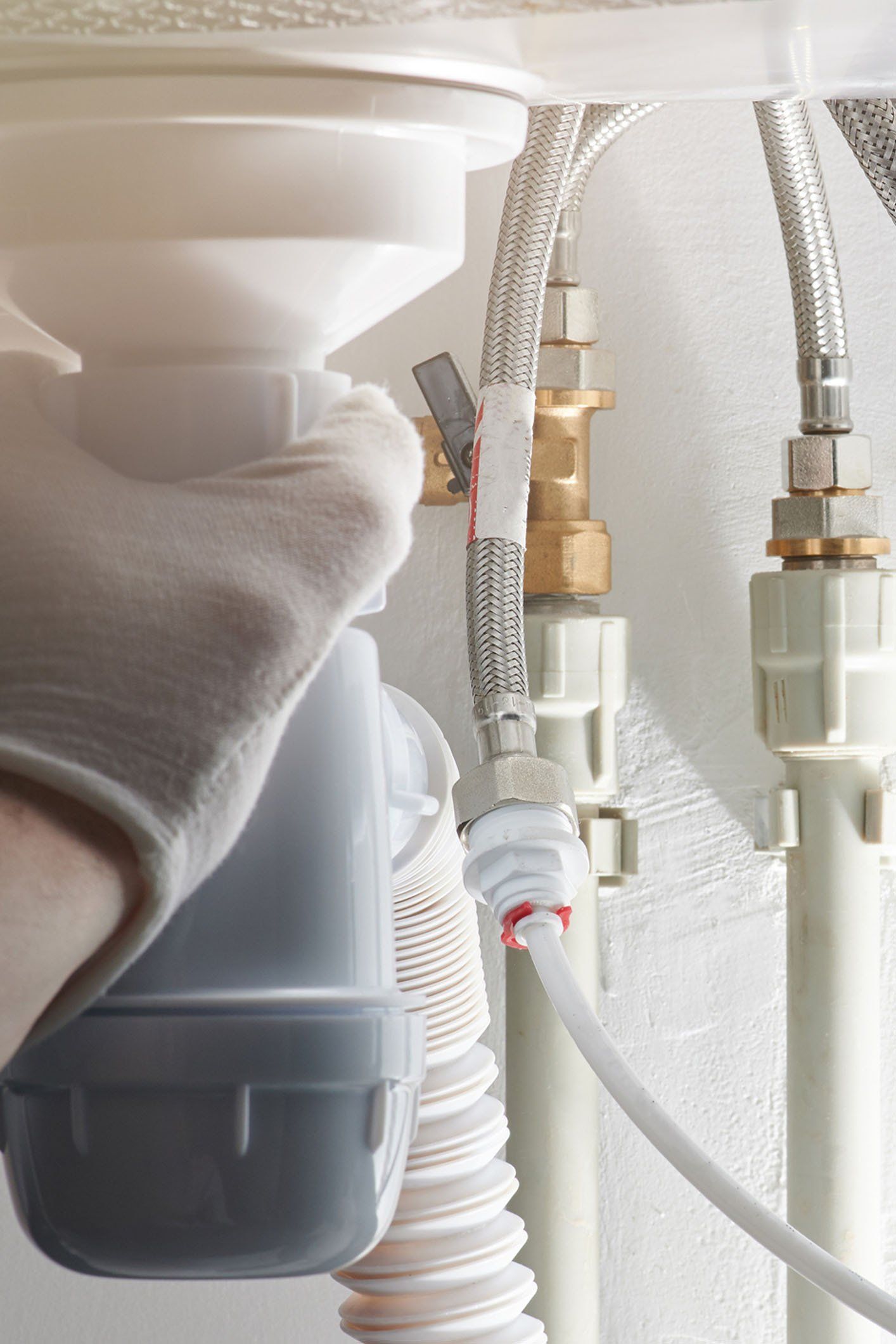 Connecting Pipes Under Sink — Okemos, MI — Michigan Plumbing Connecting Pipes Under Sink — Okemos, MI — Michigan Plumbing