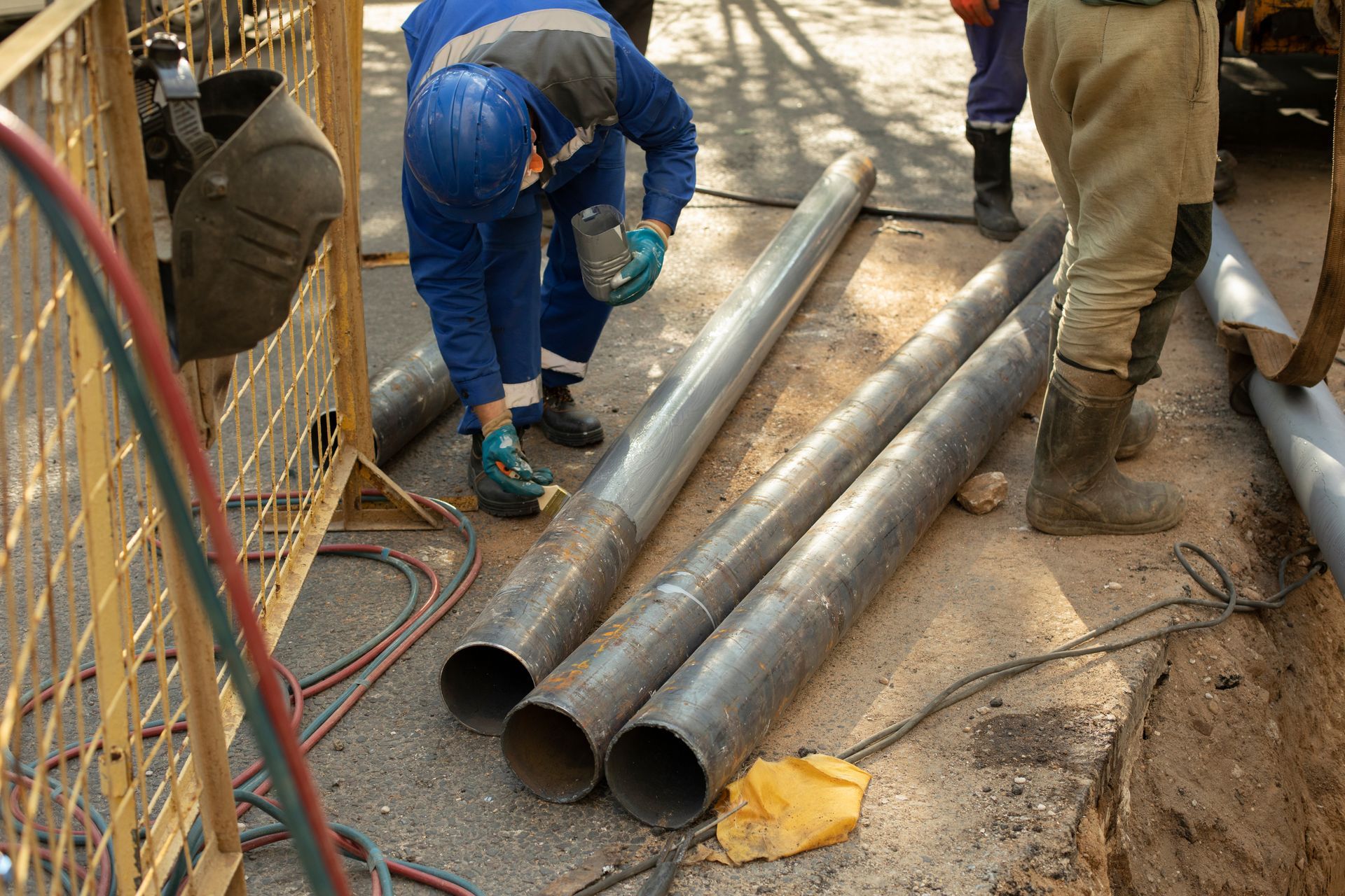 A man is working on a sewer line replacement.