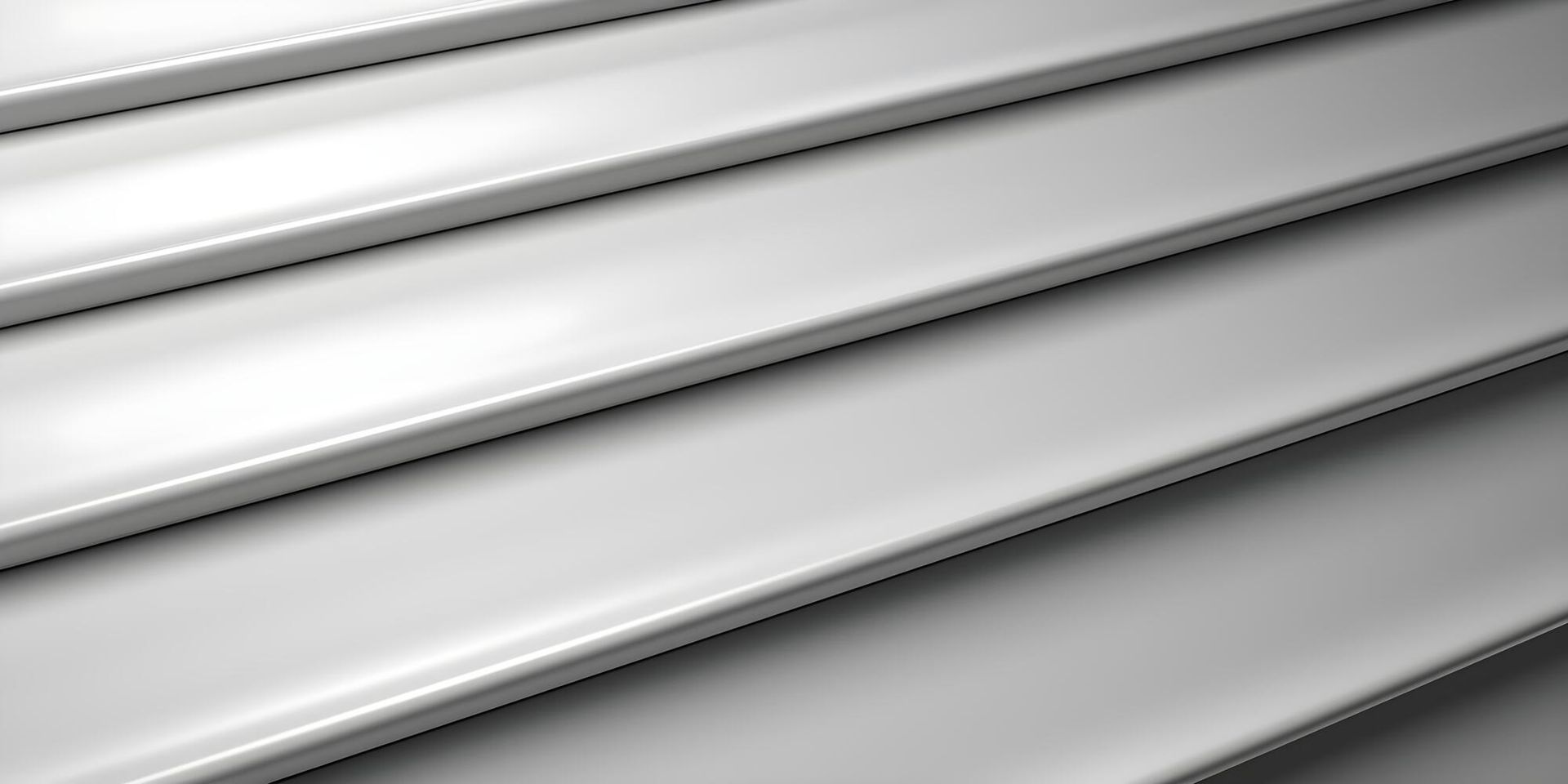 Close-up of white horizontal metal blinds with subtle highlights and shadows.