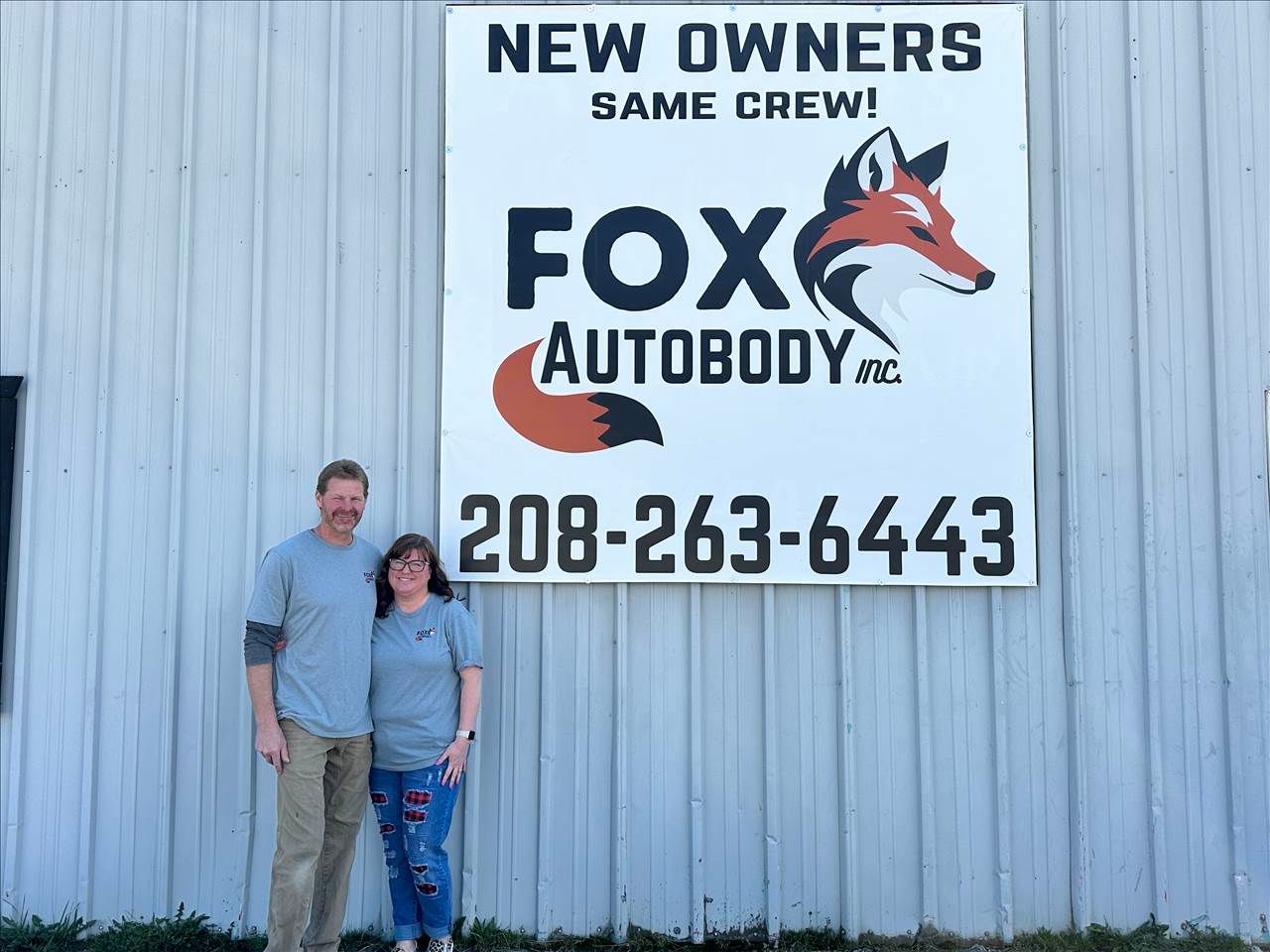 Owners Dave and Julie Fox stand outside their newly aquired autobody shop
