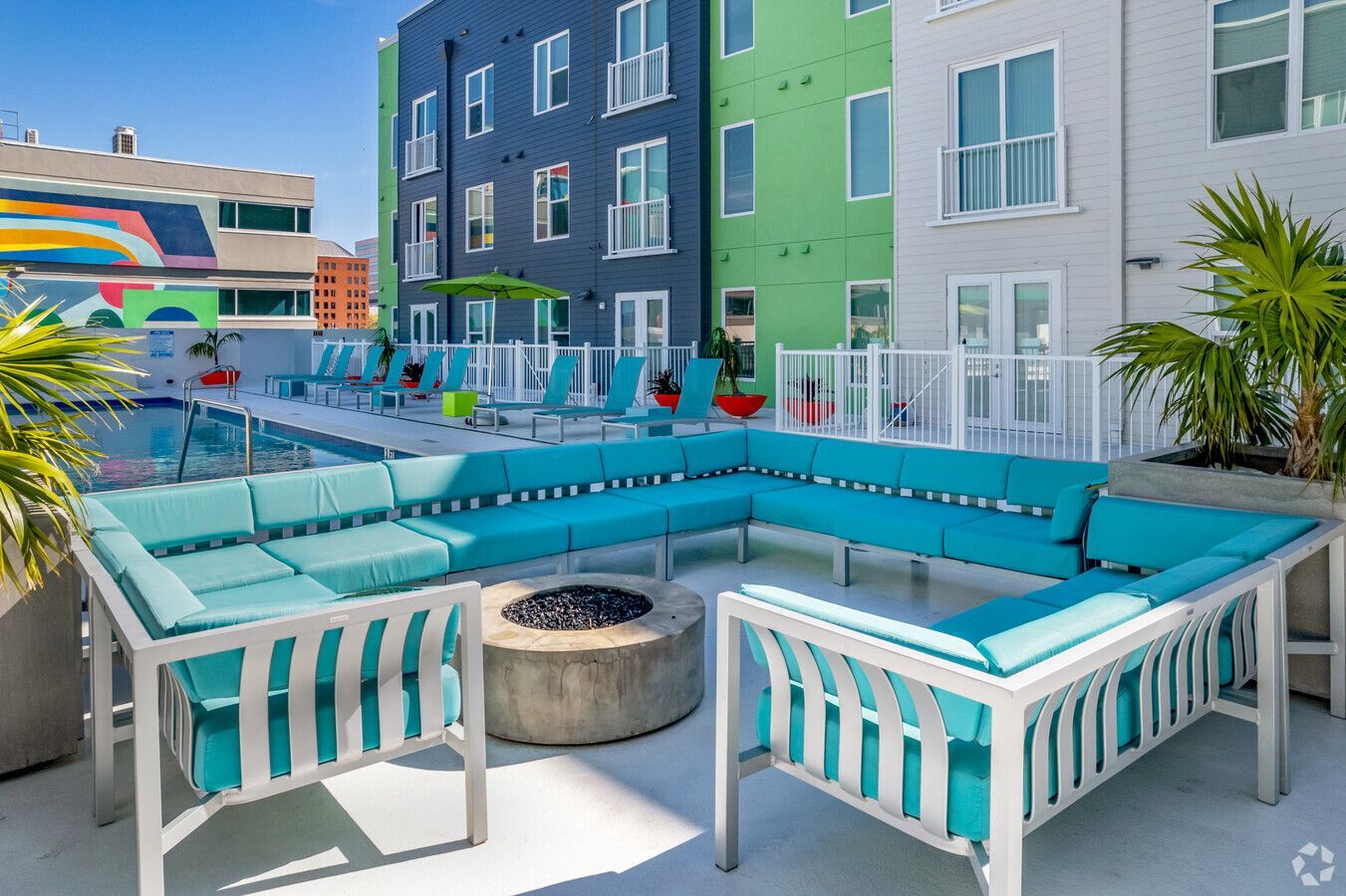 There is a fire pit in the middle of the patio area.