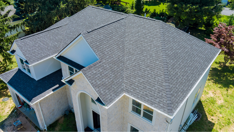 Roofing crew installing shingles on a Florida home