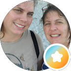 Two smiling women in a circular selfie, with a small orange star icon in the corner