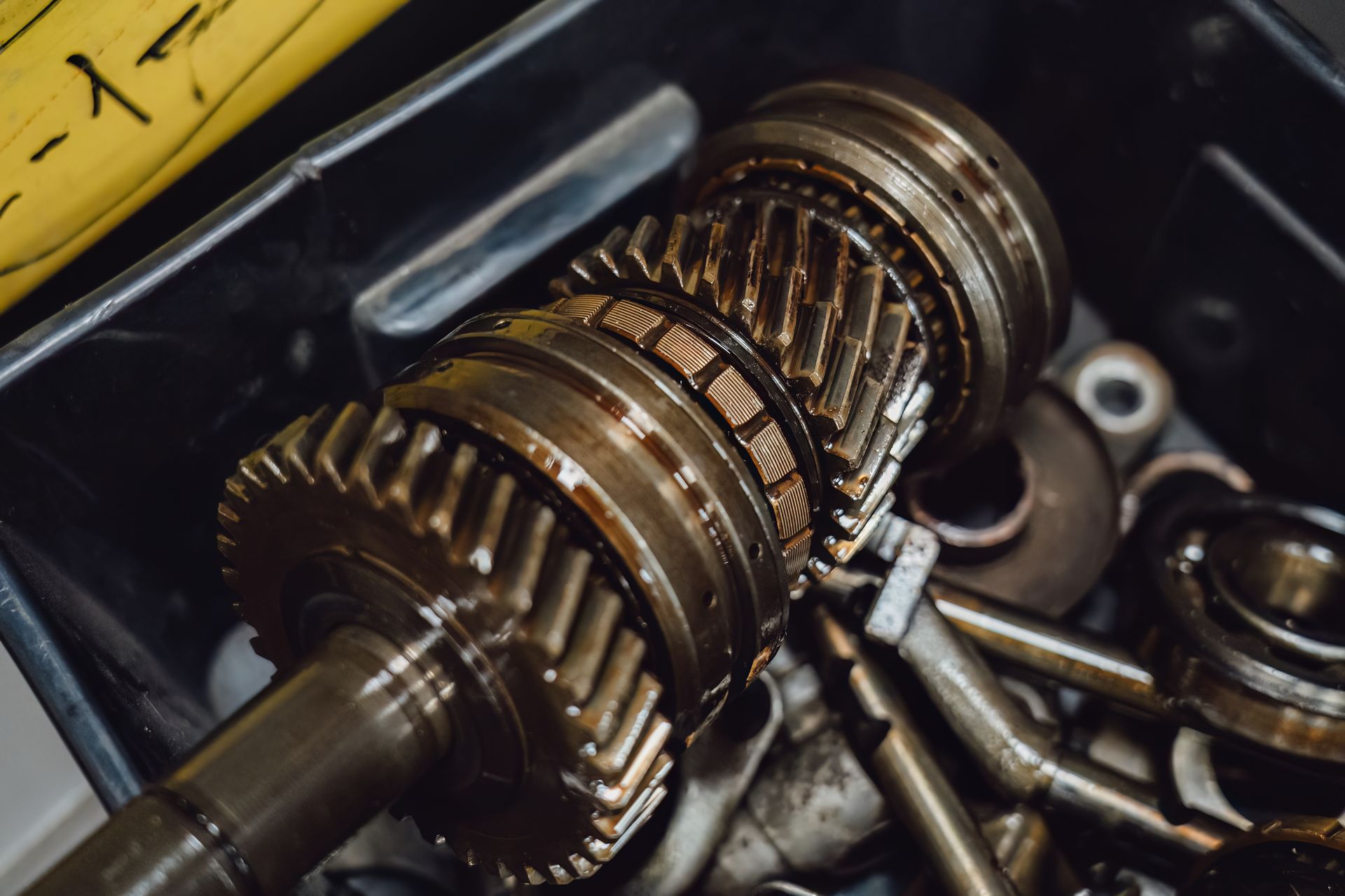 Close-up of gearbox gears during transmission replacement service showing metal parts detailview. Close-up of gearbox gears during transmission replacement service showing metal parts detailview.