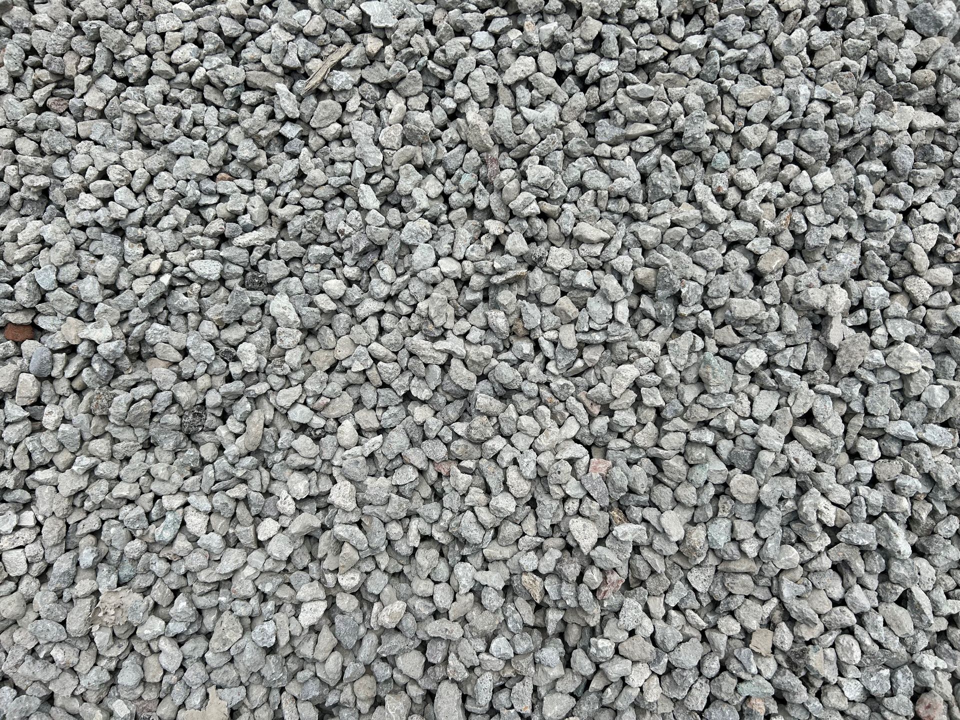 Close-up of a pile of small, gray gravel rocks.