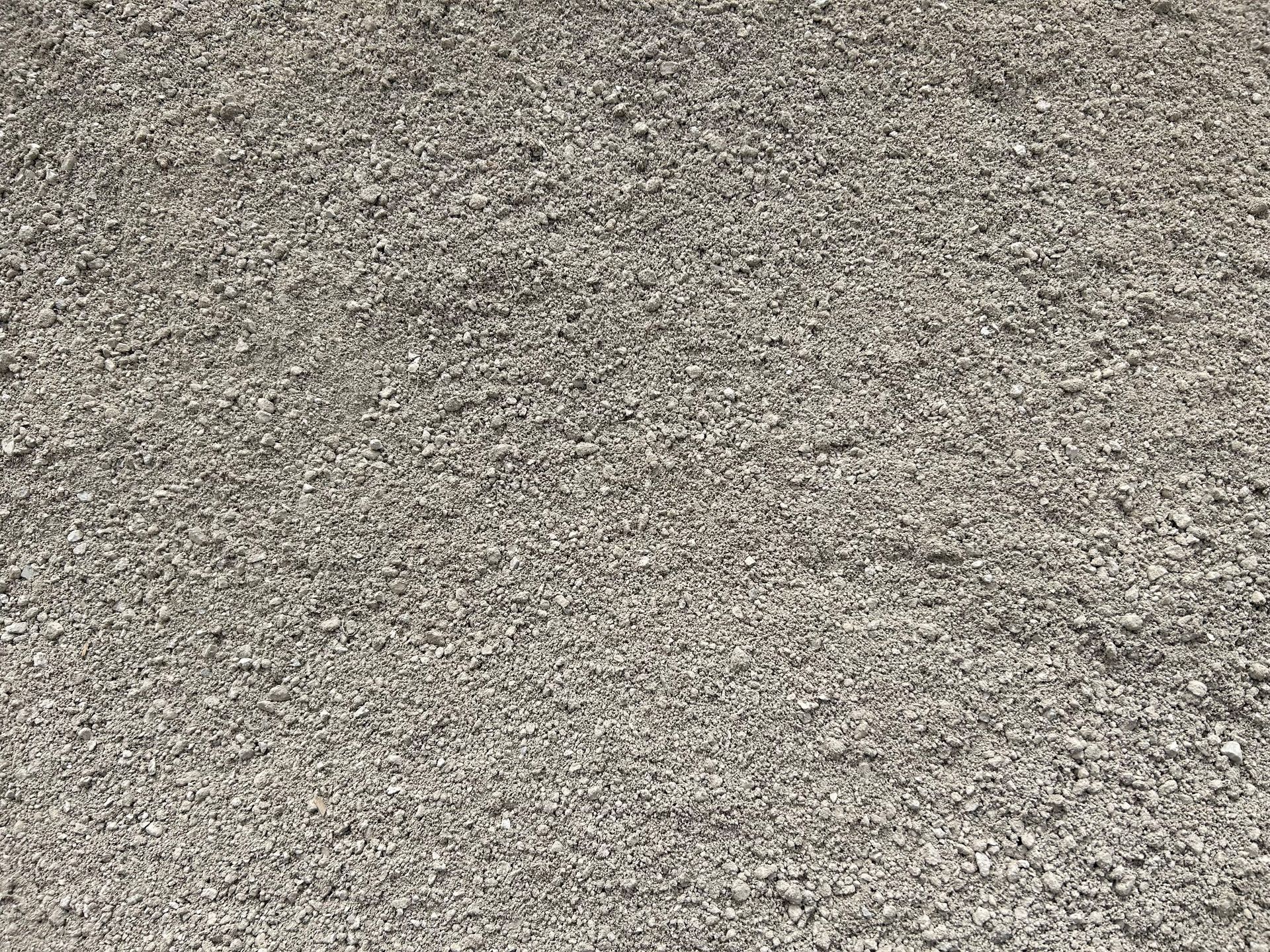 Gray gravel surface, small stones densely packed.