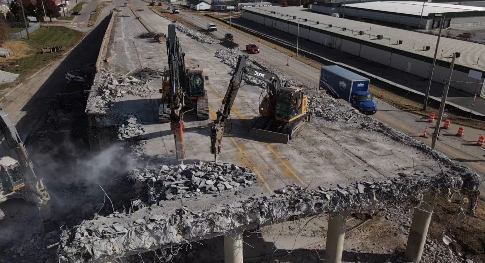 A worker with a sledgehammer demolishing a wall, site rearrangement. A worker with a sledgehammer demolishing a wall, site rearrangement.
