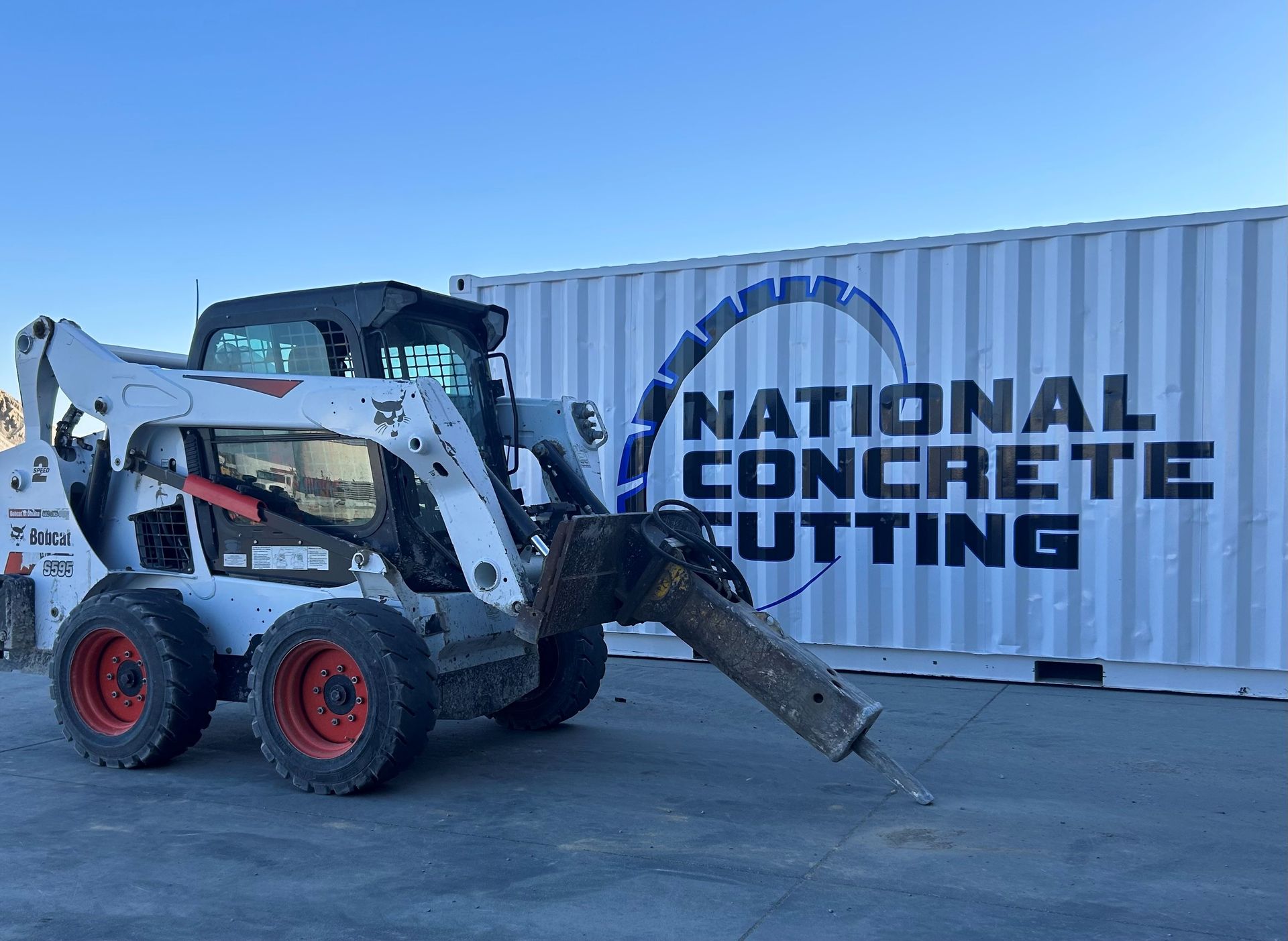 Skilled worker demolishing interior wall performing concrete breaking service in Omaha, NE.
