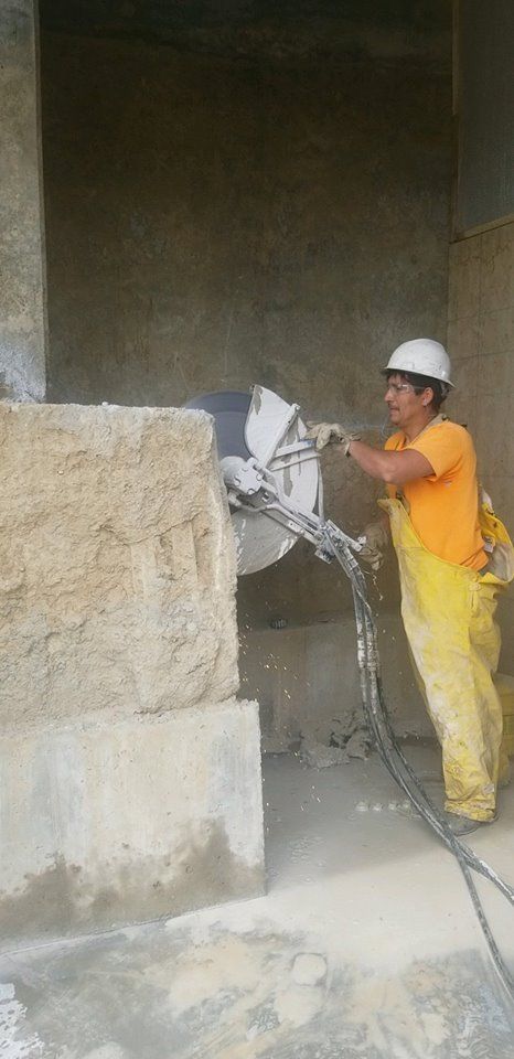 Man Holding Sawing Machine - Council Bluffs, IA - National Concrete Cutting