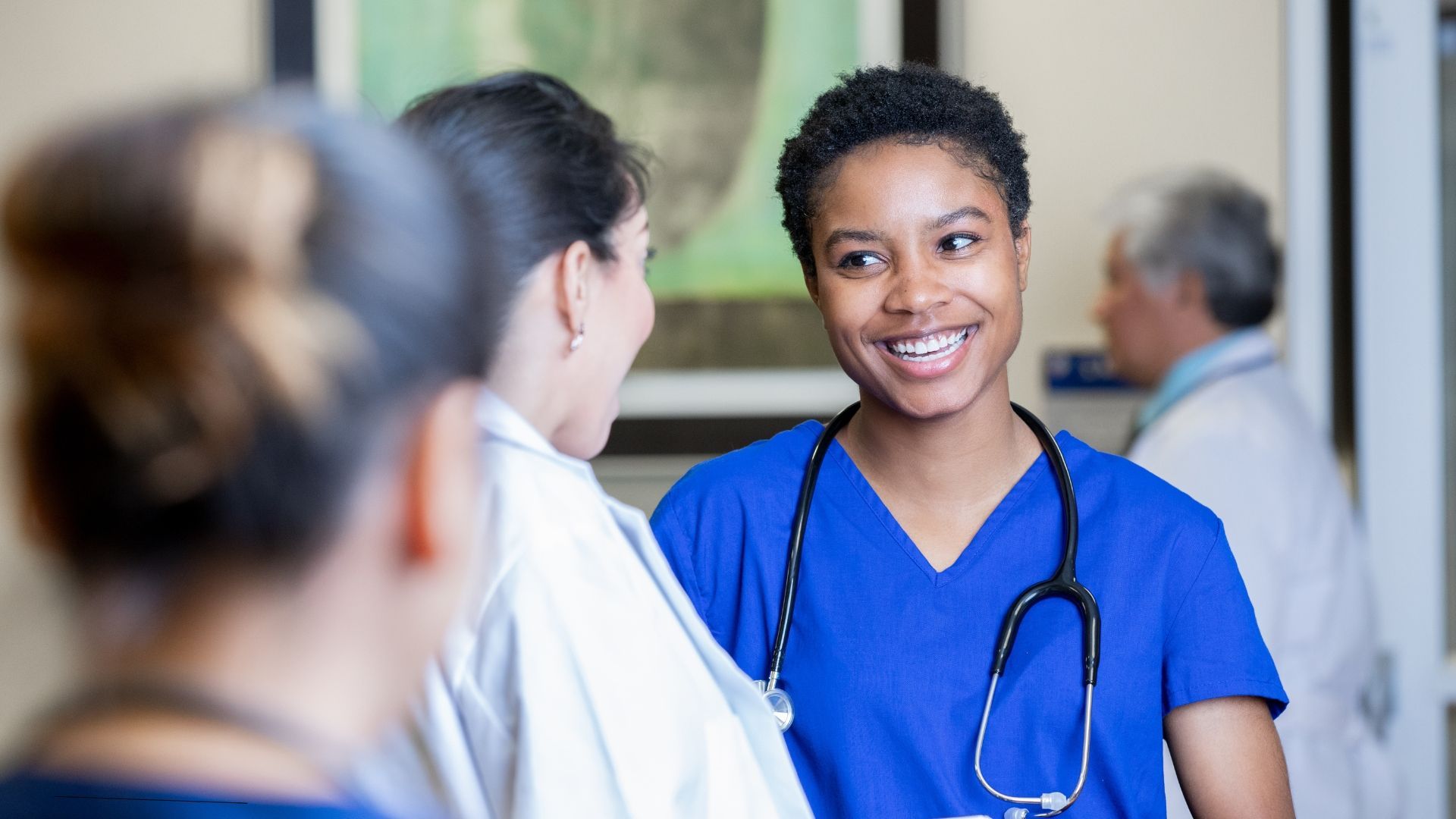 Smiling nurse arriving at a new assigment.