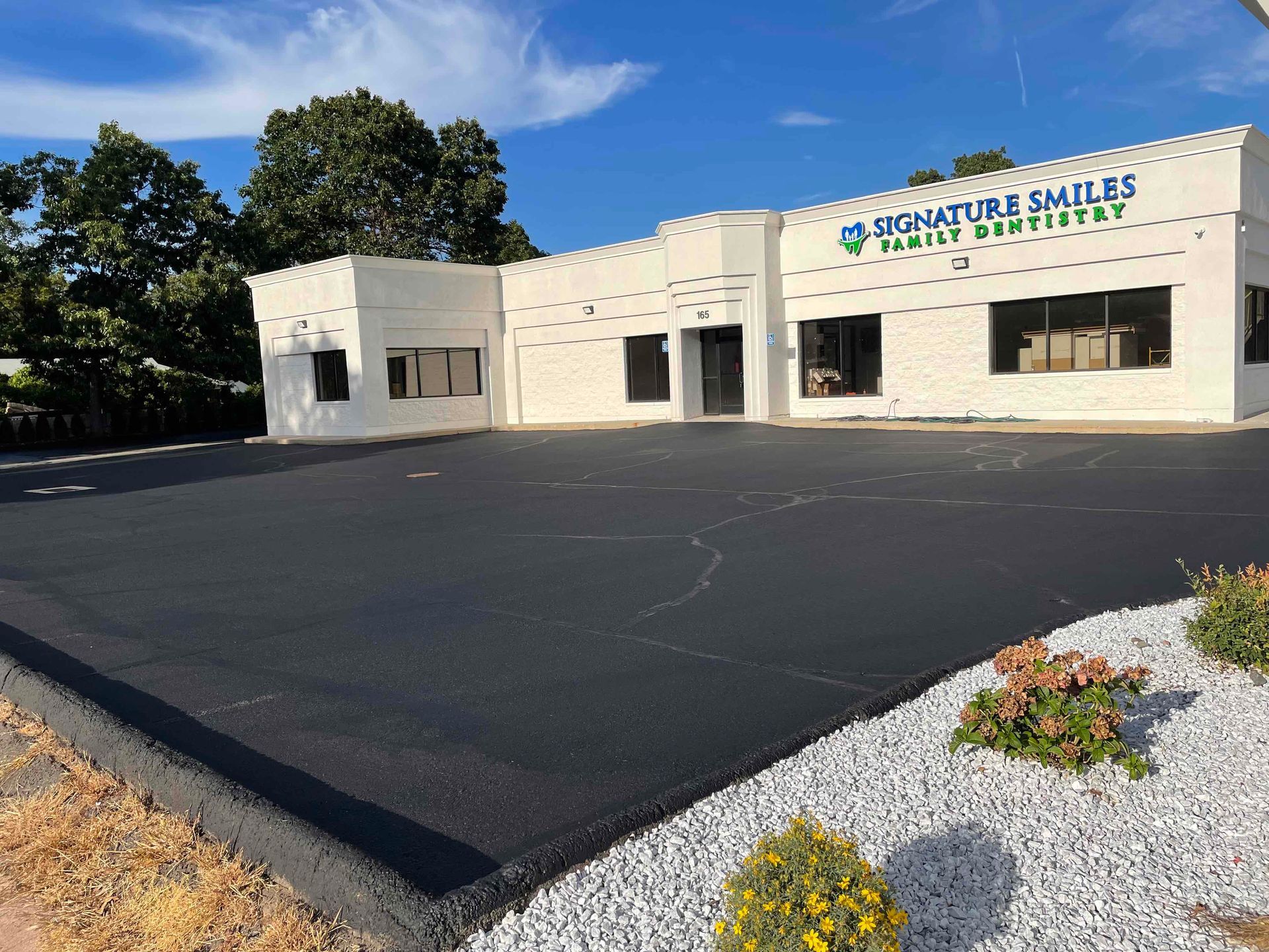 commercial parking lot crack filling and seal coating job in glastonbury, connecticut landscape solutions