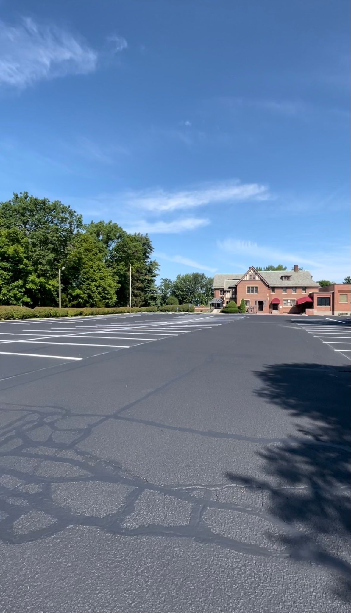 Crack filling older driveway in need or repair, Connecticut Landscape Solutions