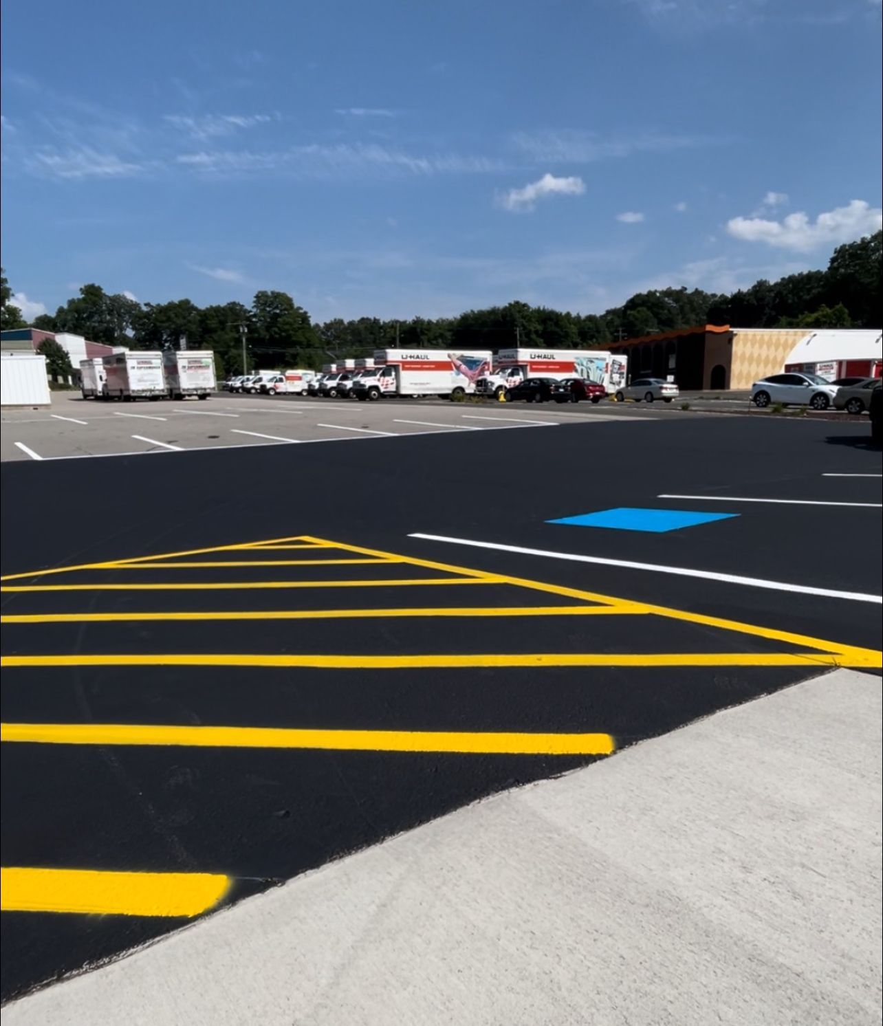 uhaul facility parking lot seal coat and line striping in hartford, ct