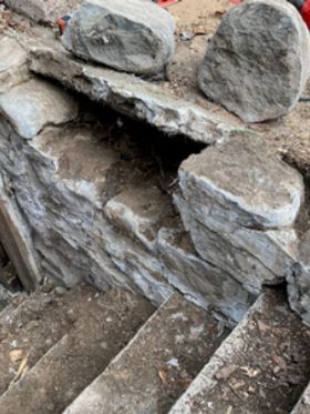 A set of stairs made of rocks and dirt.