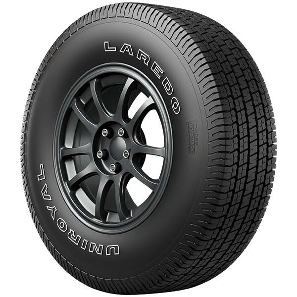 Black Uniroyal Laredo tire on a dark gray rim.