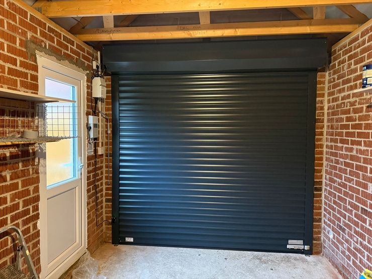 Roller garage doors peterborough, Roller garage door installer, Somfy