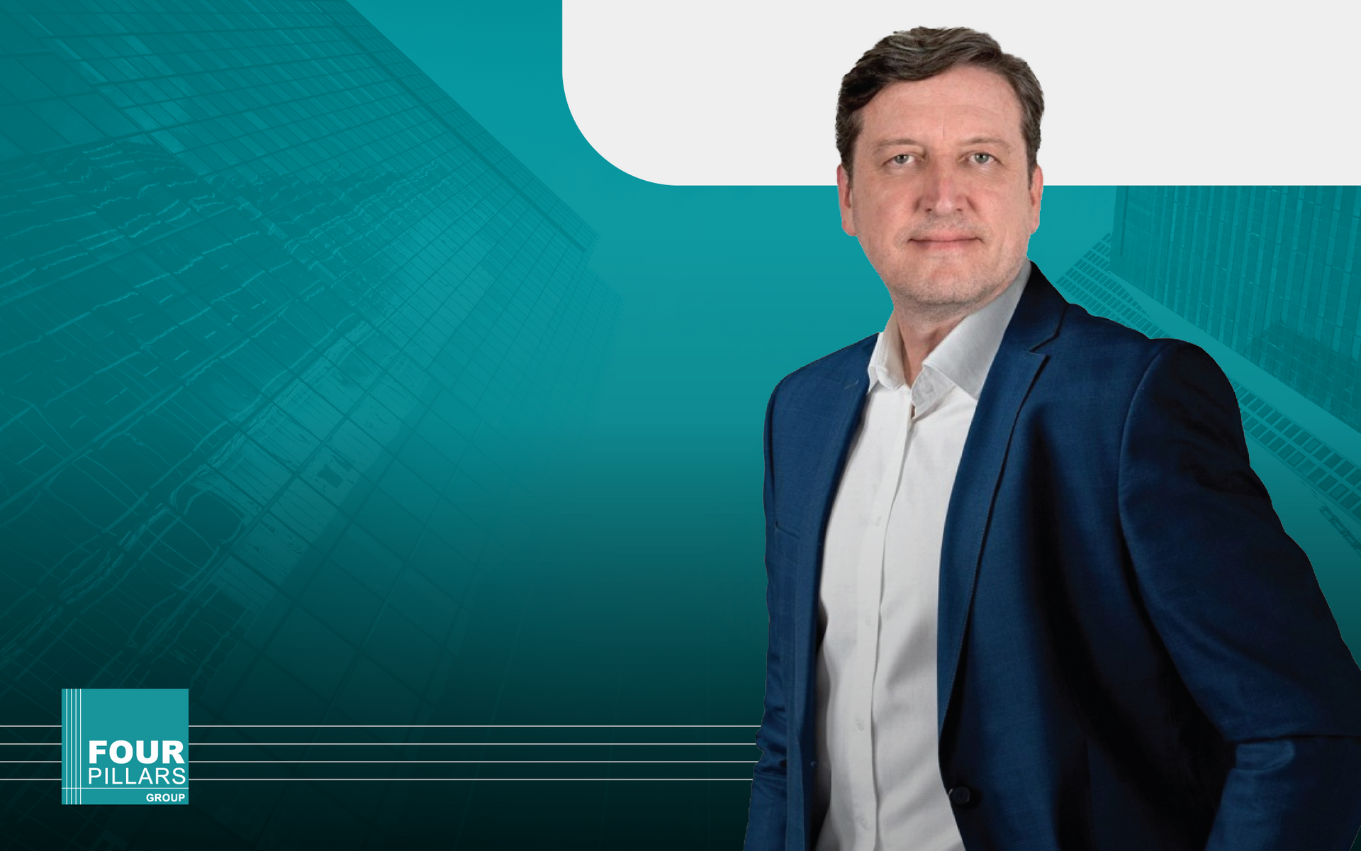 Man in a blue blazer against a teal background with a small “FOUR” logo in the corner
