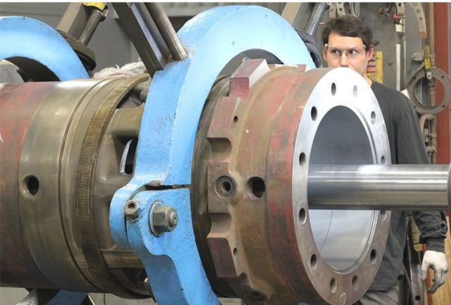 A cylinder being bored out to apply a fresh thermal spray coating.