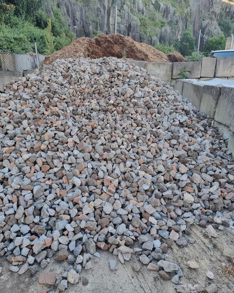 A Pile Of Rocks Is Sitting On The Ground Next To A Pile Of Dirt — Burnetts On Barney in Gerringong, NSW