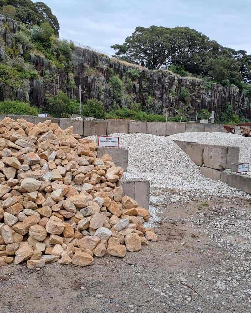 A Pile Of Rocks Is Sitting On The Ground In A Field — Burnetts On Barney in Shell Cove, NSW