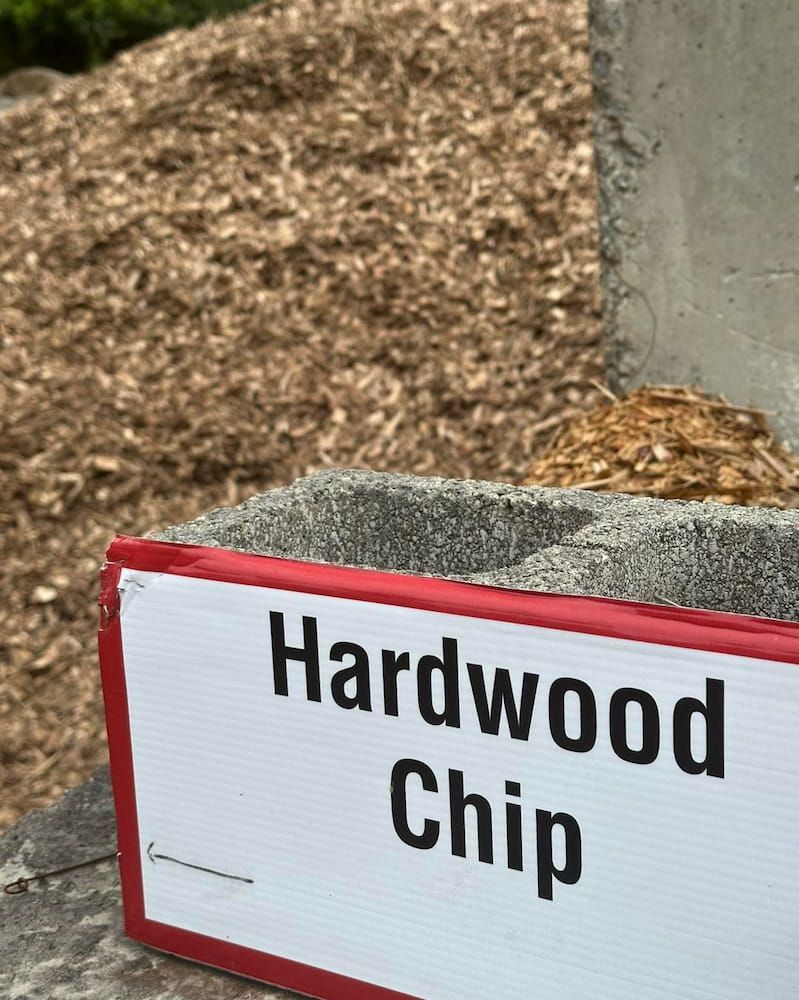 A Sign That Says Hardwood Chip In Front Of A Pile Of Hardwood Chips — Burnetts On Barney in Flinders, NSW
