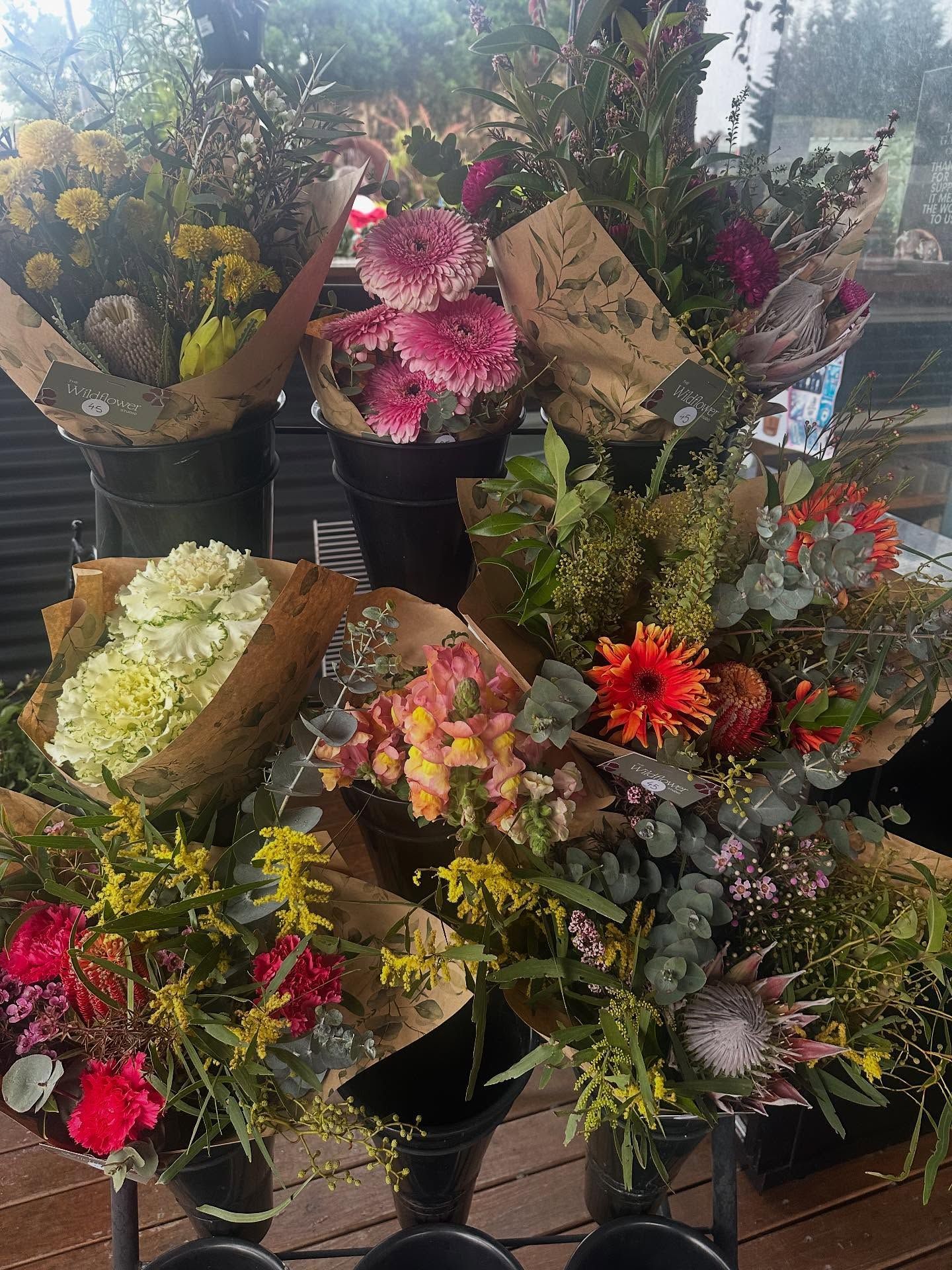 <p class="rteBlock">Bouquets of Colorful Flowers Wrapped in Brown Paper — Burnetts On Barney in Kiama, NSW</p>